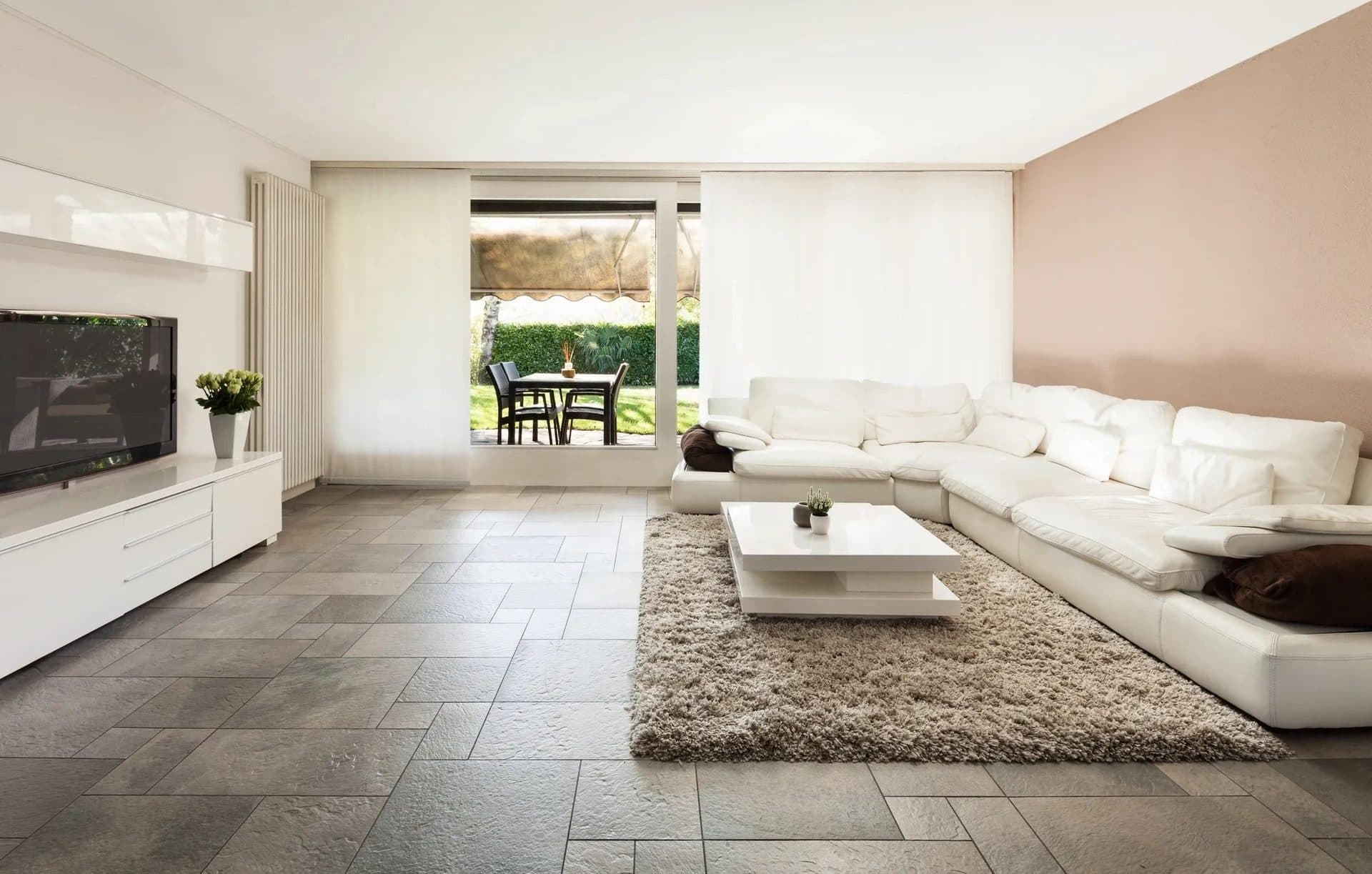 White sectional sofa with throw pillows in a bright living room