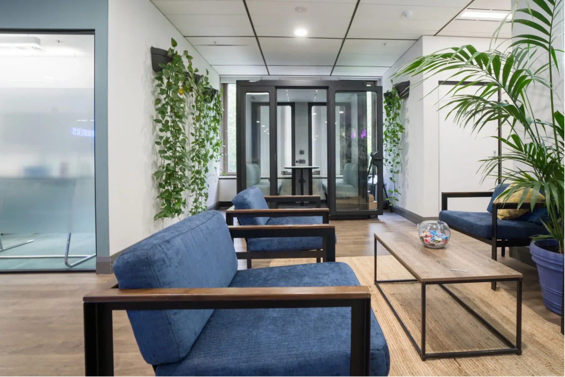 Blue fabric-upholstered lounge chairs in an office