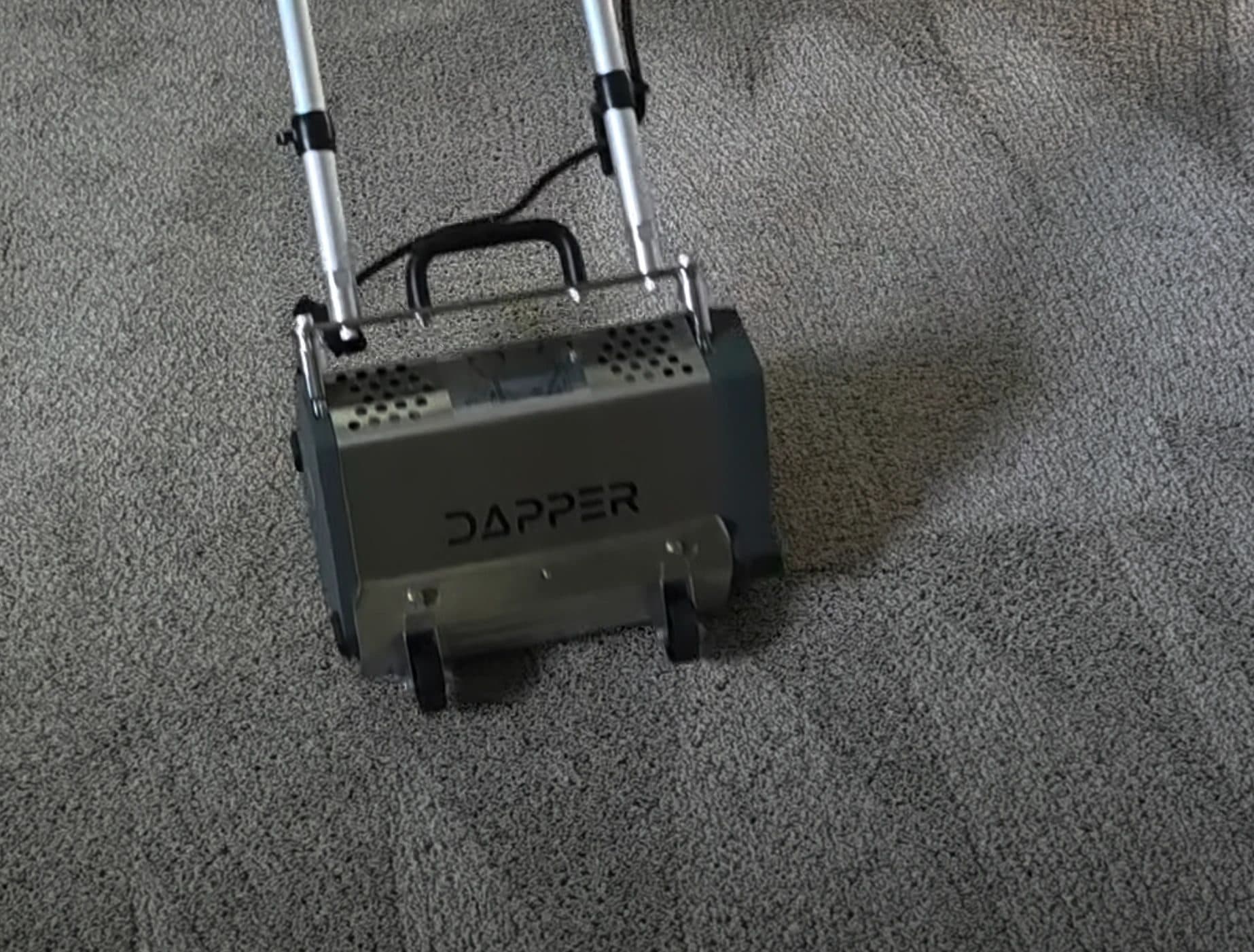 Dapper counter-rotating brush machine on gray carpet